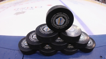 Official pucks sit on the boards prior to warmups for the World Cup of Hockey on September 18, 2016 in Toronto.