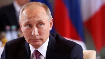 Putin Says Sanctions Would 'Harm' Relations, But He's Not Worried Yet