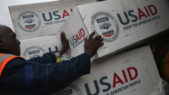 Workers unload medical supplies to fight the Ebola epidemic from a USAID cargo flight on August 24, 2014 in Harbel, Liberia.