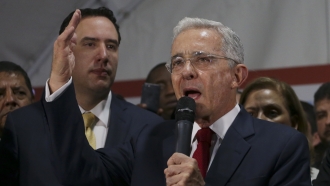 Former Colombian President Alvaro Uribe speaks to supporters.