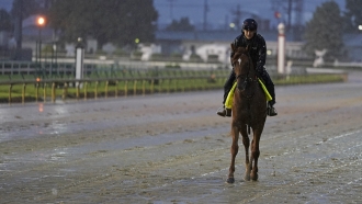 Racehorse Attachment Rate works out for Saturday's Kentucky Derby, to be run with protesters outside and no fans inside.