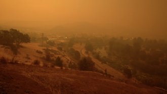 Record breaking wildfires burn in Oregon, turning the sky a hazy orange.