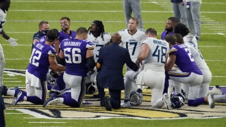 Tennessee Titans and the Minnesota Vikings players meet at midfield.