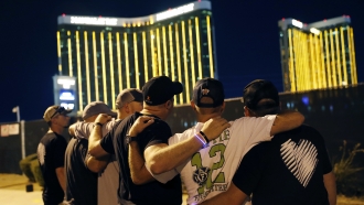 Survivors return to the scene of a mass shooting on the first anniversary in Las Vegas.