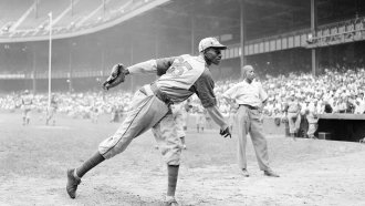Kansas City Monarchs pitcher Leroy Satchel Paige warms up at New York's Yankee Stadium before a Negro League game