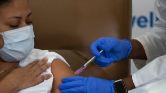 Person receives coronavirus vaccine