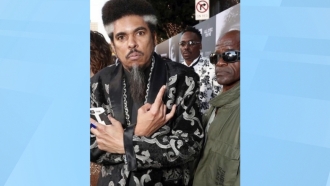 Shock G, left, poses at the "All Eyez On Me" film premiere in Los Angeles on June 14, 2017