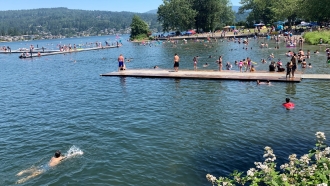 People flock to Bloedel Donovan park during an uncharacteristic Pacific Northwest heat wave Sunday, June 26, 2021.