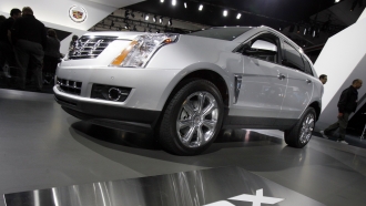 A 2013 Cadillac SRX displayed at the New York International Auto Show