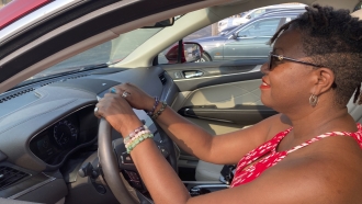 A woman sits behind the wheel of a 2019 Lincoln MKC.