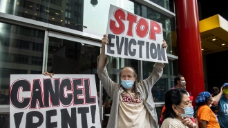 Housing advocates protest against evictions.