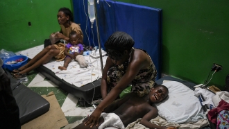 A boy grimaces in pain, at the Immaculee Conception hospital in Les Cayes, Haiti.