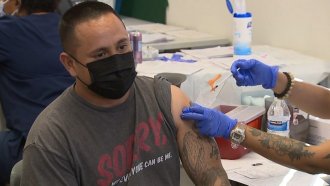 Man receives vaccine.