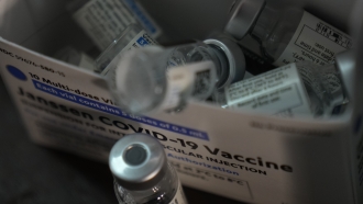 Empty vials of the Johnson & Johnson vaccine for COVID-19.