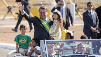 Brazilian President Jair Bolsonaro arrives for a flag raising ceremony at Alvorada Palace presidential residence.