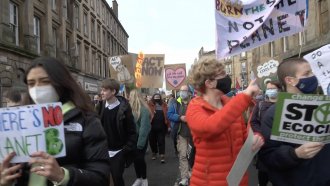 Young people march at a climate change rally.