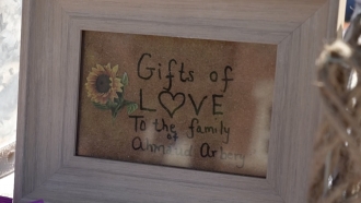 A sign for gifts in support of Ahmaud Arbery's family