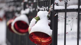 A coating of snow covers holiday ornaments in Denver, Colorado.