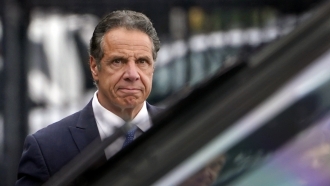 New York Gov. Andrew Cuomo prepares to board a helicopter after announcing his resignation