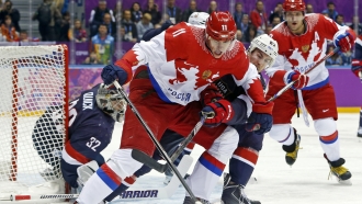 Russian and U.S. players in a men's ice hockey game