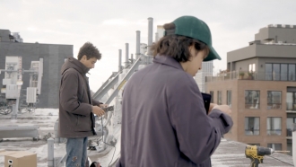 NYC MESH volunteers working on a rooftop