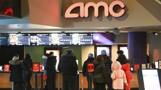 People line up for movie tickets at an AMC theater in New York