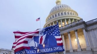 A flag depicting President Donald Trump flies on the East Front of the U.S. Capitol
