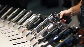 Handguns are displayed at the Shooting, Hunting and Outdoor Trade Show in Las Vegas