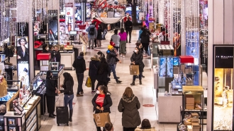 Shoppers walk through Macy's on Nov. 26, 2021, in New York.