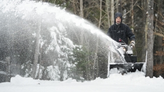 Man using snow blower