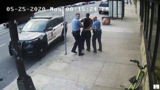 Image from video shows Minneapolis police officers arresting George Floyd.