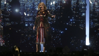 Singer Adele performing on stage.
