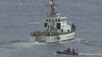 Coast Guard Cutter Ibis' crew searching for people missing from a capsized boat off the coast of Florida.