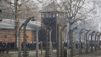 People are seen arriving at the site of the Auschwitz-Birkenau Nazi German death camp