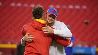 Kansas City Chiefs quarterback Patrick Mahomes hugs Buffalo Bills quarterback Josh Allen