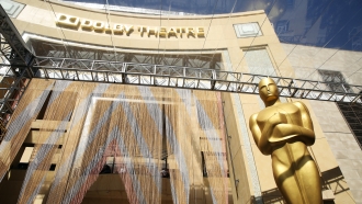 An Oscar statue appears outside the Dolby Theatre.