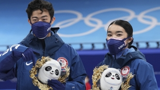 Silver medalists Karen Chen and Nathan Chen pose for a photo after the team event in the Olympic figure skating competition