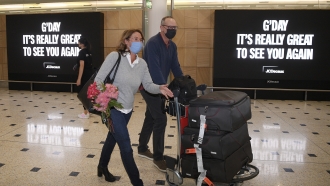 Passengers arrive at Sydney International Airport in Sydney.