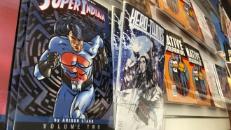 Comic books sit on display.