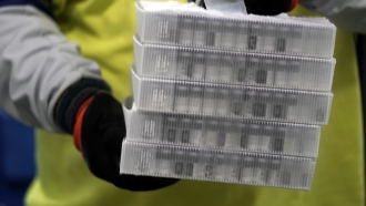 Boxes containing Pfizer vaccines.