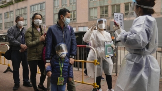 People line up to receive China's Sinovac COVID-19 coronavirus vaccine.