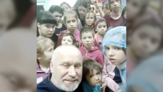 Vladimir Sagaidak with children as his orphanage in Kherson, Ukraine