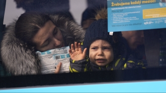 Boy fleeing Ukraine on bus