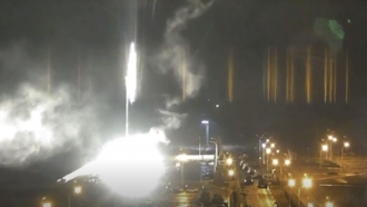 This image made from a video released by Zaporizhzhia nuclear power plant shows bright flaring object landing