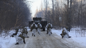 Ukrainian National Guard forces exercise as they simulate a crisis situation near the Chernobyl Power Plant.
