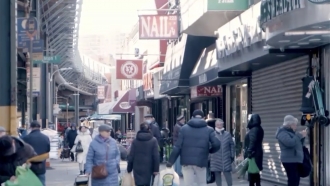 People walk on a New York City street.