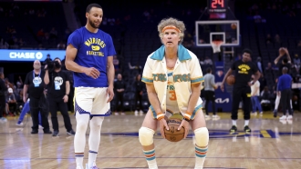 Will Ferrell warms up with Golden State Warriors guard Stephen Curry