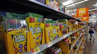 Display of scented markers and crayons on store shelves