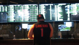 Man places a sports bet at a casino