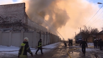 Firefighters try to put out a fire in Kharkiv, Ukraine